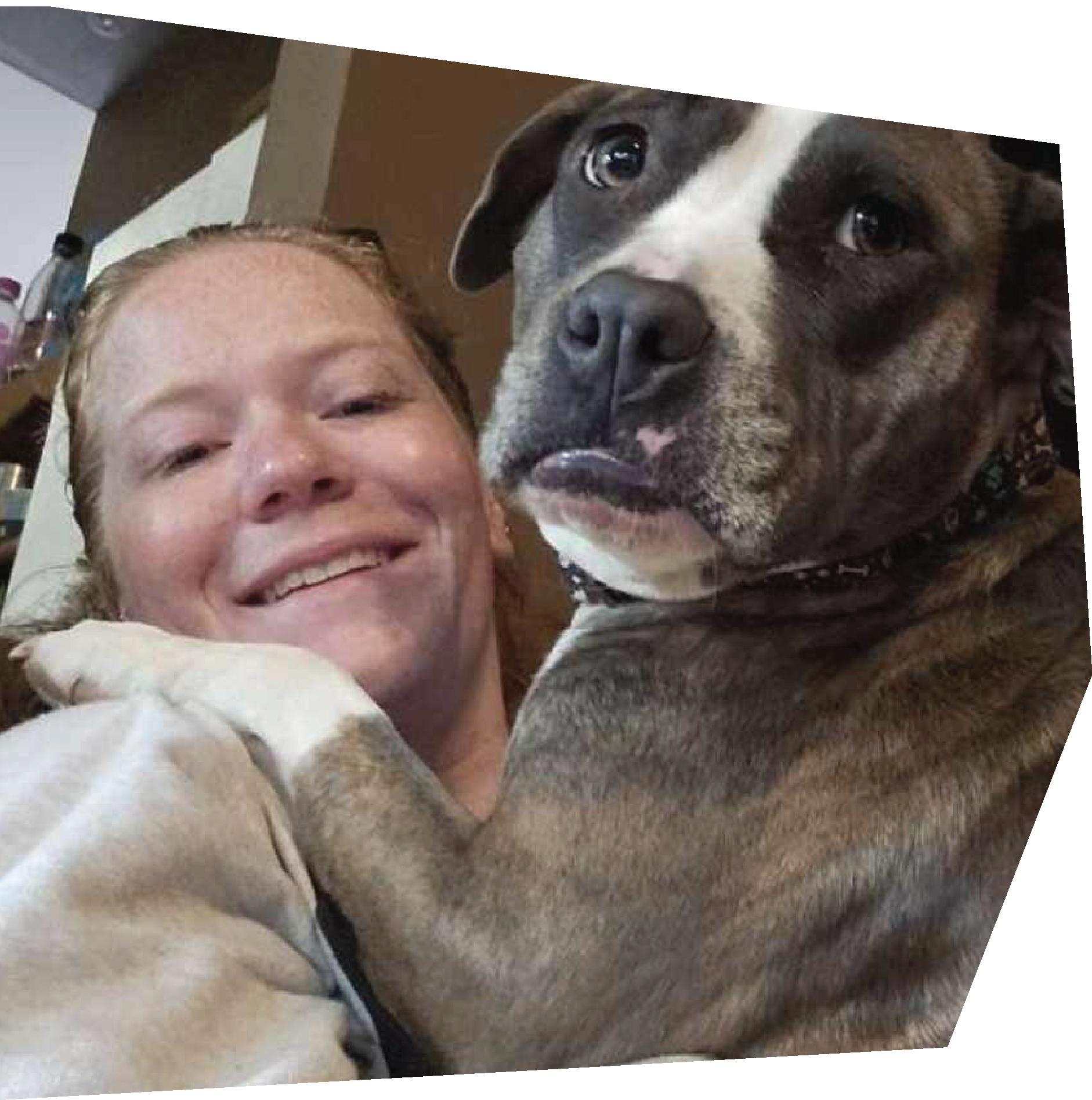 Large dog with paws around a smiling woman’s shoulders