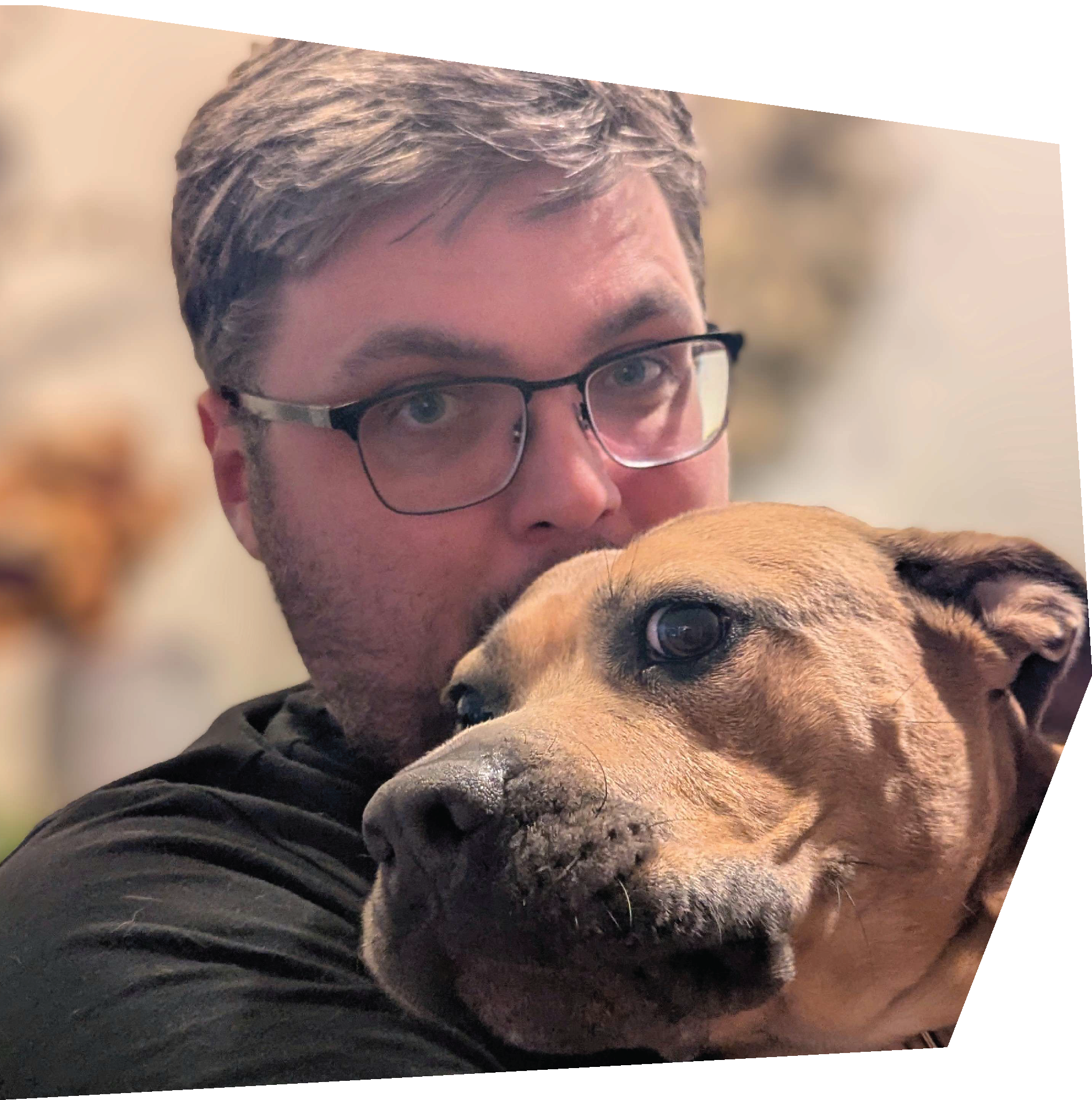 man kissing large dog’s head