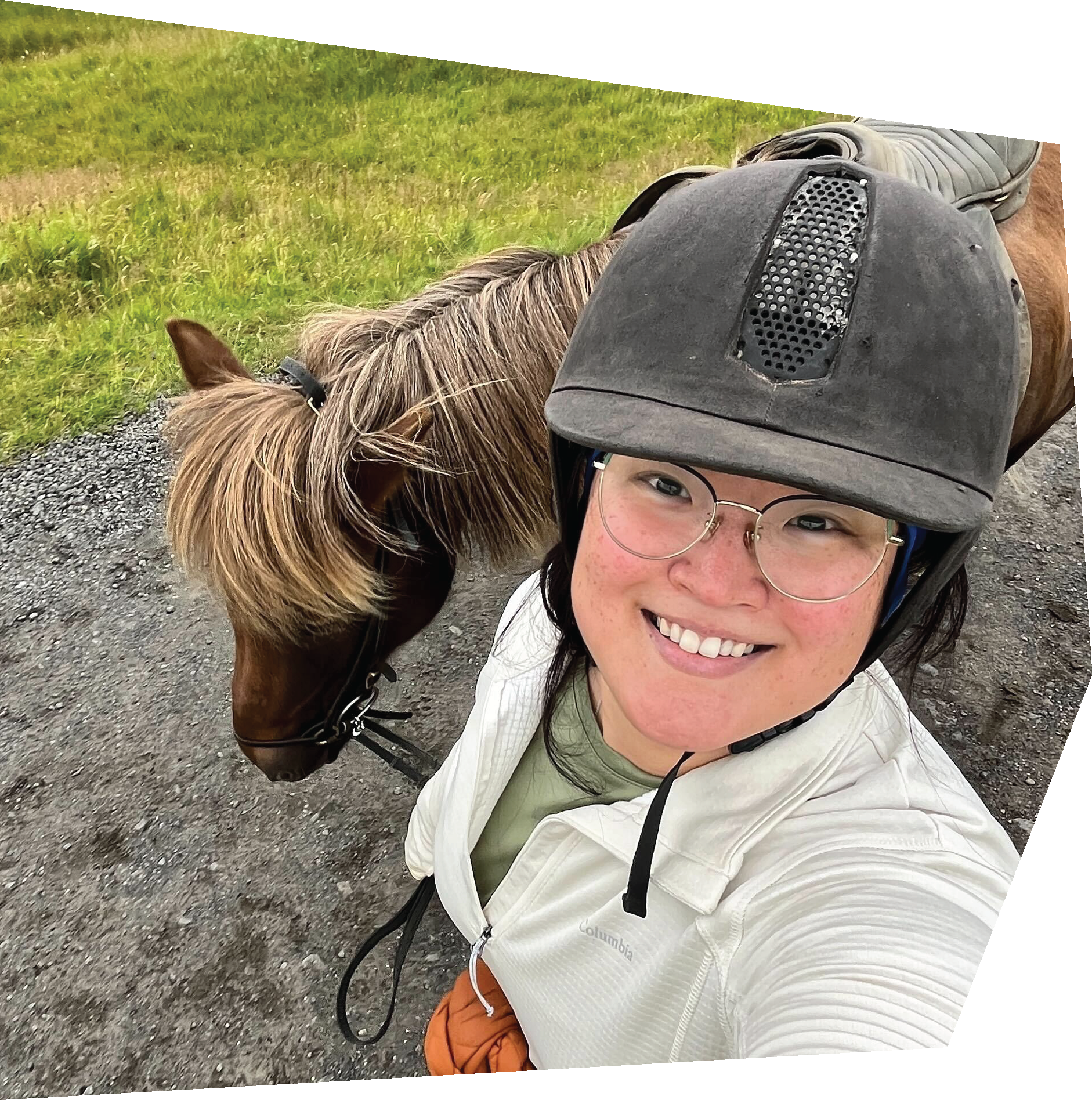 woman standing with a pony